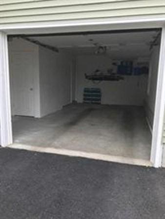 garage with asphalt driveway
