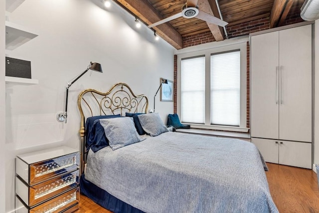 9 W Broadway Unit 311, Boston, MA 02127 - bedroom with wooden ceiling with exposed beams, wood finished floors, and track lighting