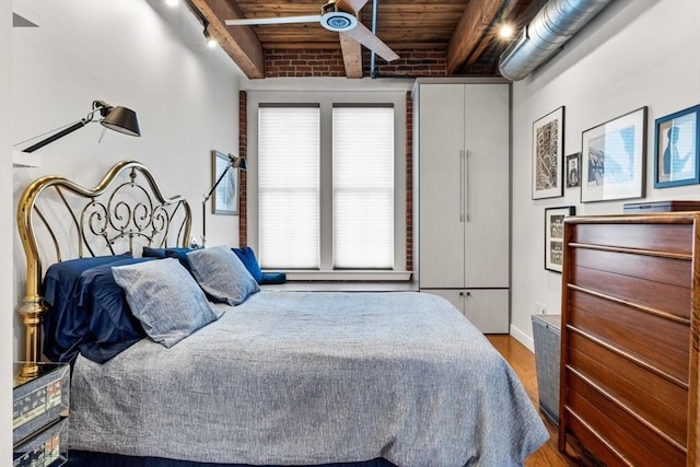 9 W Broadway Unit 311, Boston, MA 02127 - bedroom with wood ceiling with exposed beams and wood finished floors