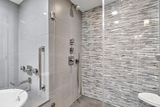 9 W Broadway Unit 311, Boston, MA 02127 - bathroom featuring tile walls, a tile shower, and a tub to relax in