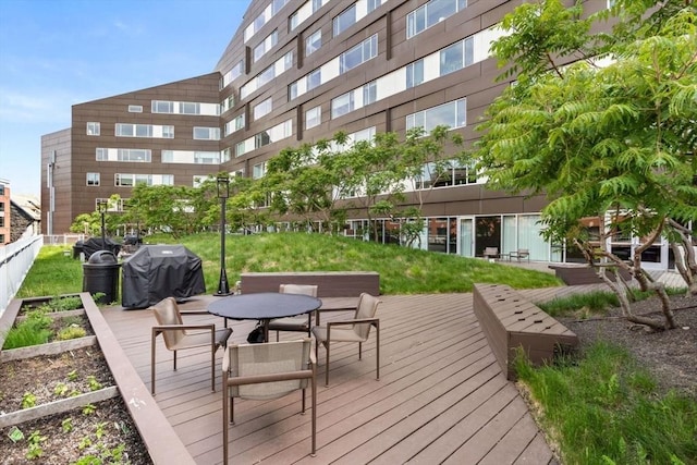 9 W Broadway Unit 311, Boston, MA 02127 - wooden deck with a grill and outdoor dining space