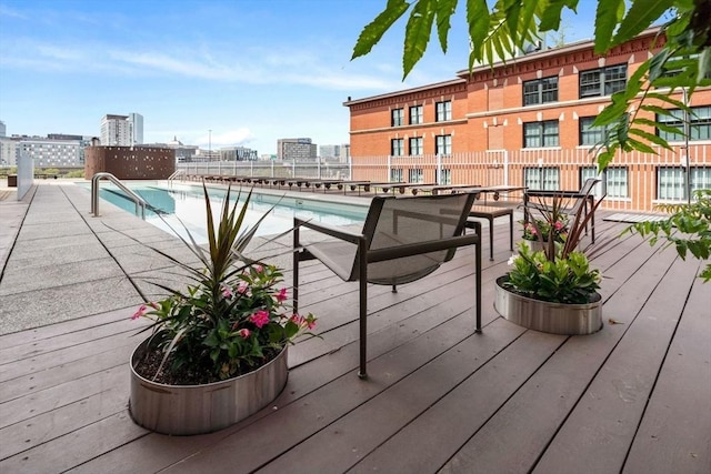 9 W Broadway Unit 311, Boston, MA 02127 - wooden terrace featuring a view of city and a community pool