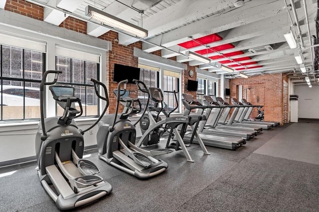 9 W Broadway Unit 311, Boston, MA 02127 - gym featuring plenty of natural light, brick wall, and baseboards