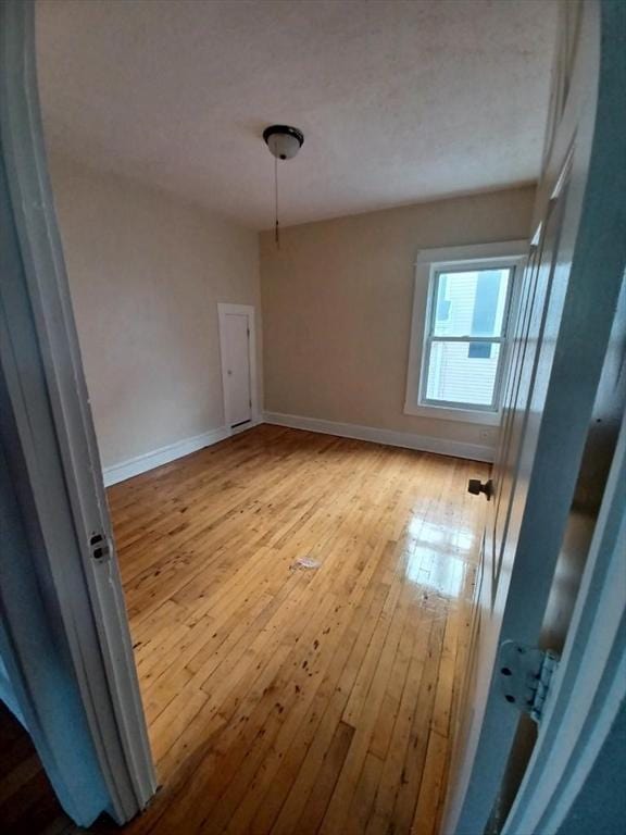 unfurnished dining area featuring light wood-type flooring