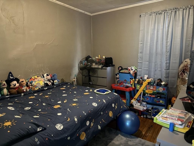 unfurnished bedroom with crown molding and wood-type flooring