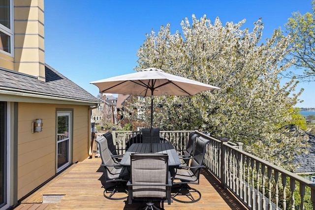 wooden deck with outdoor dining space