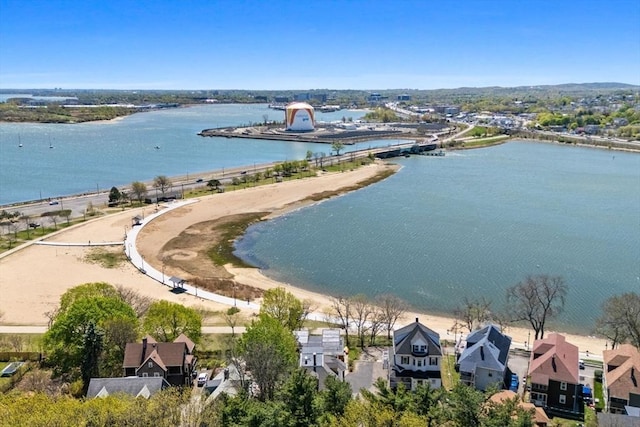 aerial perspective of suburban area with a nearby body of water