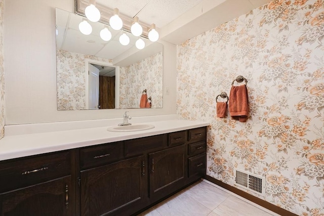 bathroom with vanity and tile patterned floors