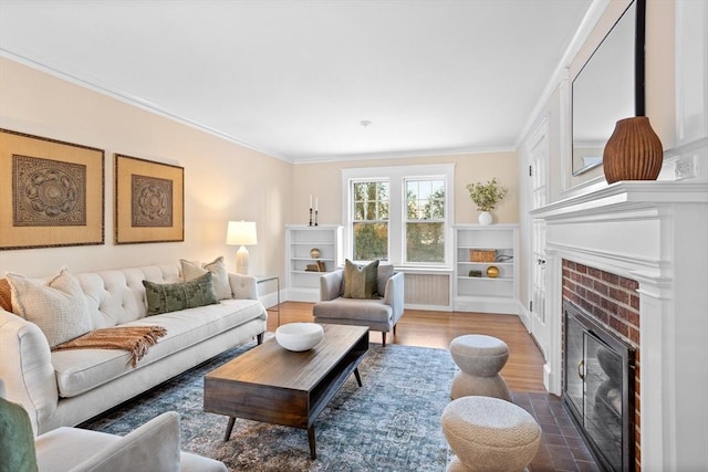 living room with crown molding, dark wood-type flooring, and a fireplace