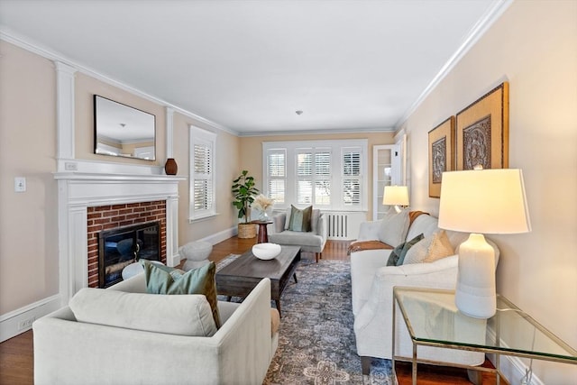 living room featuring a fireplace, crown molding, radiator heating unit, and dark hardwood / wood-style flooring