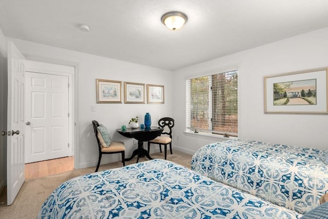 bedroom with carpet and baseboards