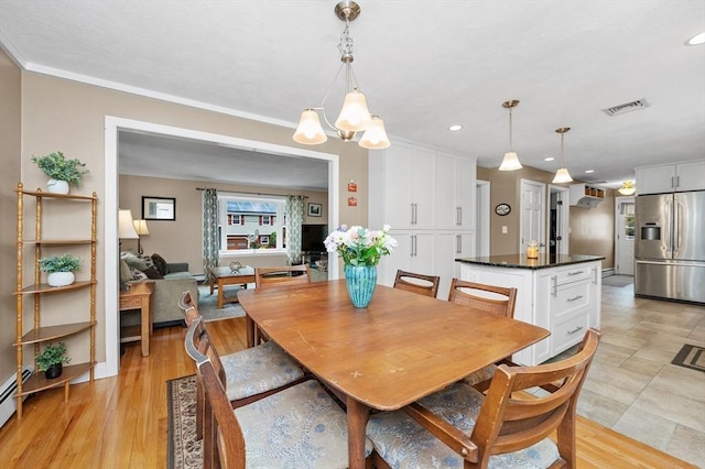 92 Gregory St, Waltham, MA 02451 - dining room featuring a chandelier, recessed lighting, and baseboard heating