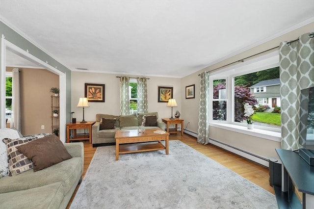 92 Gregory St, Waltham, MA 02451 - living room with wood finished floors, a baseboard heating unit, and ornamental molding