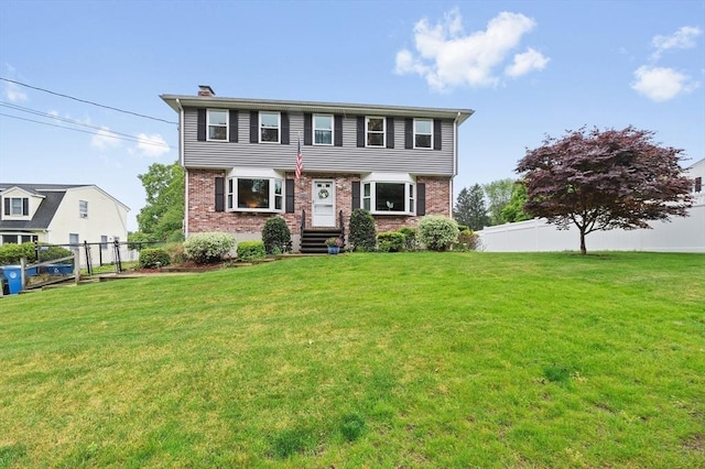 92 Gregory St, Waltham, MA 02451 - colonial house featuring brick siding and a chimney