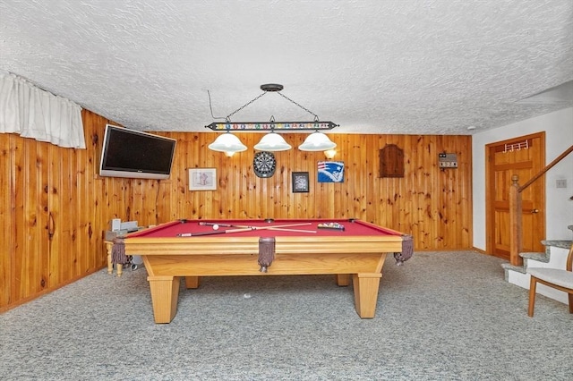 92 Gregory St, Waltham, MA 02451 - game room with carpet flooring, billiards, wood walls, and a textured ceiling