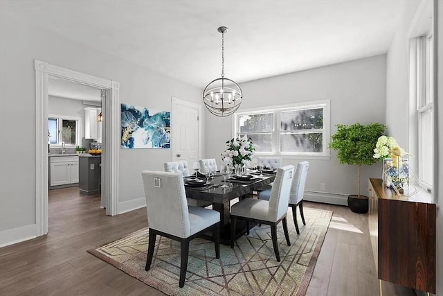 61 E Main, Merrimac, MA 01860 - dining room with a chandelier, wood finished floors, and a baseboard radiator