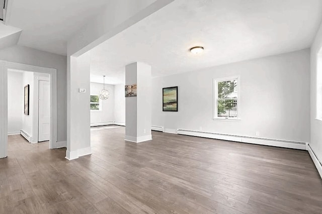 61 E Main, Merrimac, MA 01860 - unfurnished living room with a baseboard heating unit, wood finished floors, and plenty of natural light