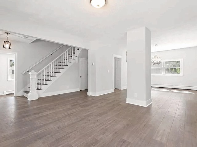 61 E Main, Merrimac, MA 01860 - unfurnished living room featuring baseboard heating, stairway, wood finished floors, and a chandelier