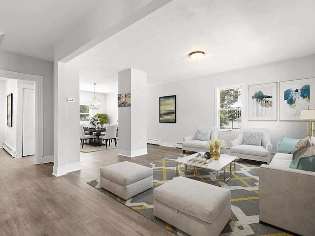 61 E Main, Merrimac, MA 01860 - living area with plenty of natural light, dark wood-type flooring, and baseboard heating