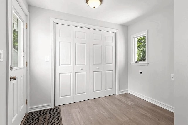 61 E Main, Merrimac, MA 01860 - unfurnished bedroom featuring wood finished floors and a closet