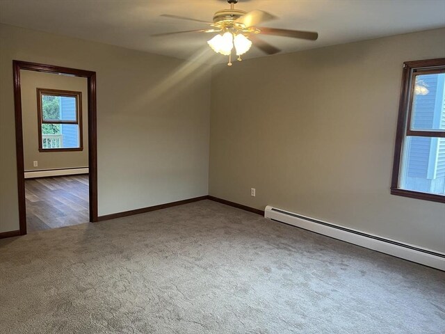 unfurnished room featuring carpet flooring, ceiling fan, and baseboard heating