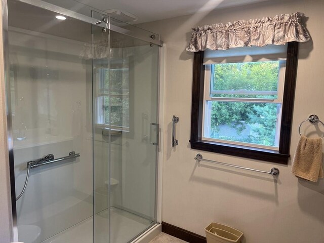 bathroom featuring an enclosed shower