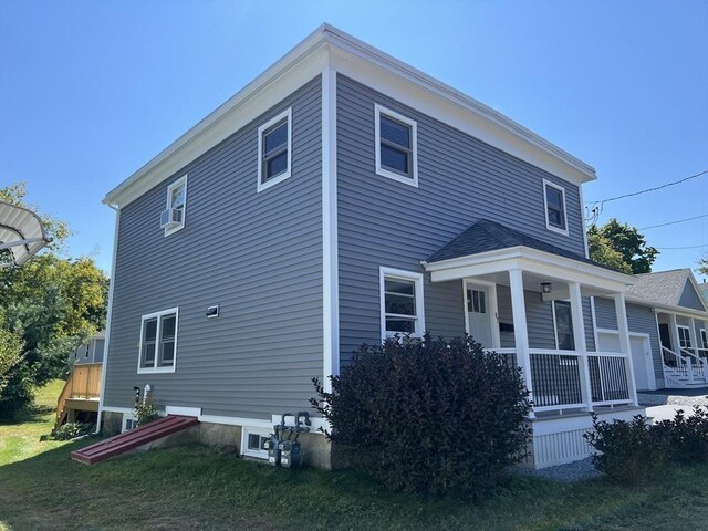 view of home's exterior featuring a yard and a deck