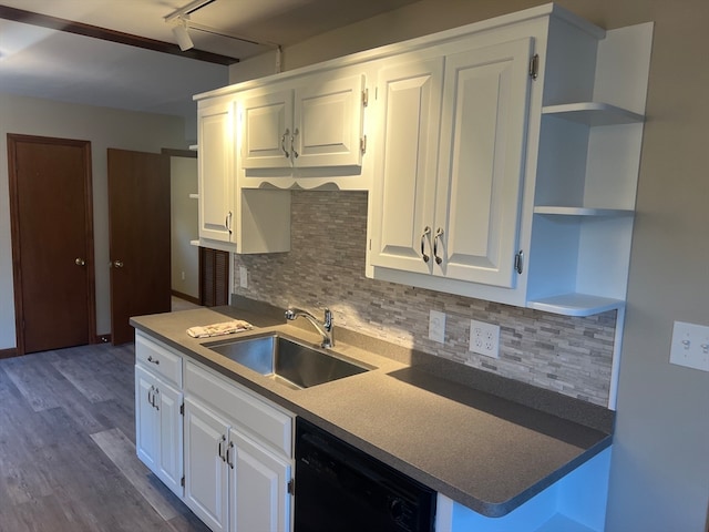 kitchen with black dishwasher, white cabinetry, wood-type flooring, and sink