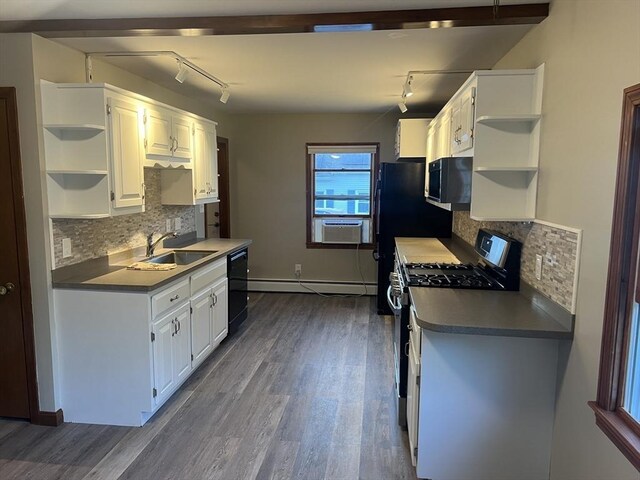 kitchen with black appliances, a baseboard radiator, dark hardwood / wood-style flooring, and white cabinetry