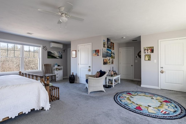 carpeted bedroom with ceiling fan, a wall mounted AC, visible vents, and baseboards