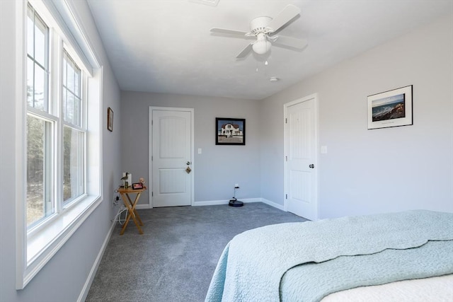 bedroom featuring carpet, multiple windows, ceiling fan, and baseboards