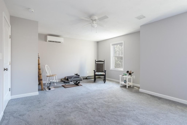 interior space with carpet floors, visible vents, a ceiling fan, an AC wall unit, and baseboards