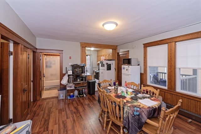 dining area with dark hardwood / wood-style flooring