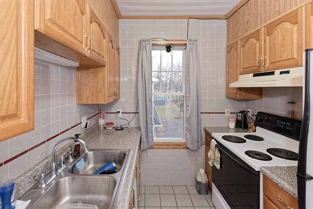 kitchen featuring decorative backsplash, sink, light tile patterned floors, tile walls, and white range with electric cooktop