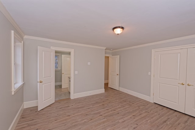 unfurnished bedroom with light wood-type flooring and ornamental molding