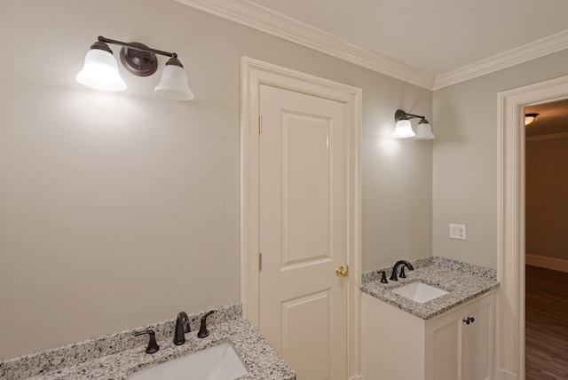 bathroom with hardwood / wood-style floors, vanity, and ornamental molding