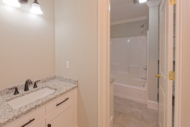 bathroom with crown molding, vanity, and  shower combination