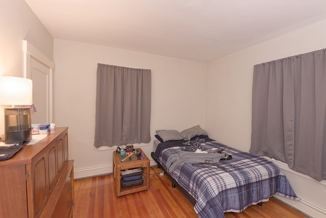 bedroom with light wood-type flooring