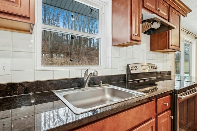 70 Donna Rd, Framingham, MA 01701 - kitchen featuring electric stove, under cabinet range hood, decorative backsplash, and brown cabinetry