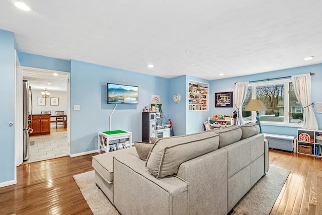 70 Donna Rd, Framingham, MA 01701 - living room featuring wood-type flooring, recessed lighting, and a chandelier