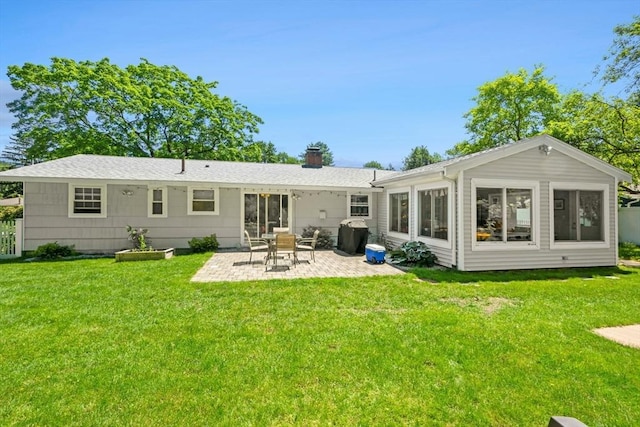 70 Donna Rd, Framingham, MA 01701 - rear view of property with a patio area, a chimney, and a lawn