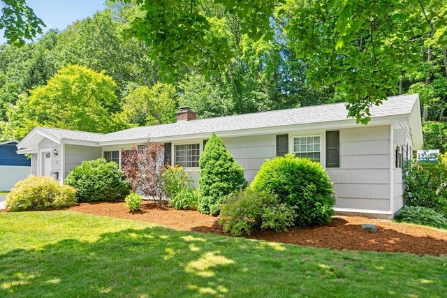 70 Donna Rd, Framingham, MA 01701 - single story home with a front lawn and a chimney