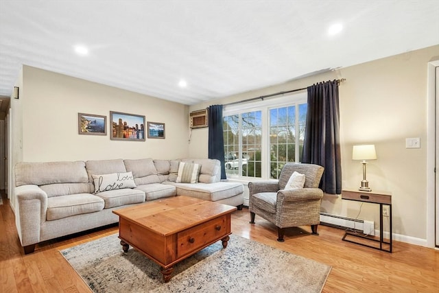 70 Donna Rd, Framingham, MA 01701 - living area with baseboard heating, light wood-style floors, a wall unit AC, and recessed lighting