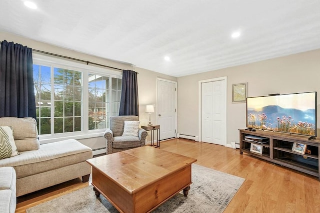 70 Donna Rd, Framingham, MA 01701 - living room featuring a baseboard radiator, recessed lighting, light wood finished floors, and baseboard heating
