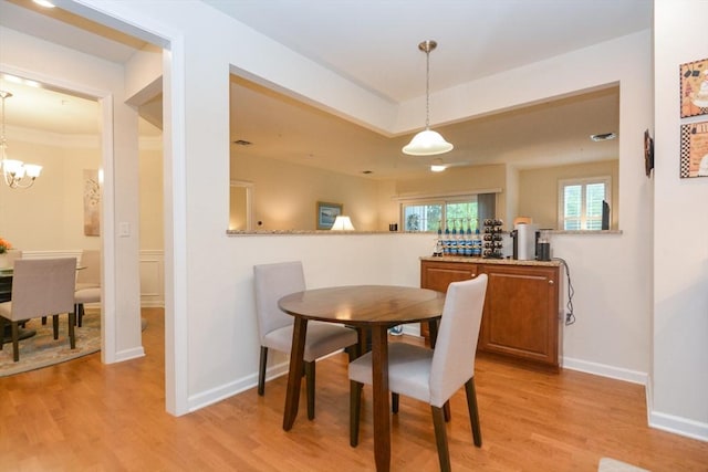 62 Abigail Way Unit 2003, Reading, MA 01867 - dining room with light wood-style floors and a chandelier