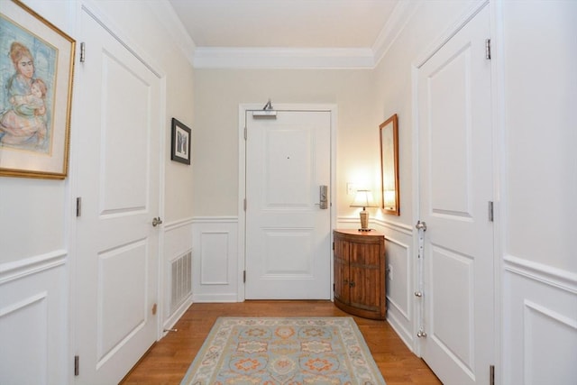 62 Abigail Way Unit 2003, Reading, MA 01867 - corridor with a decorative wall, crown molding, light wood-style floors, and a wainscoted wall