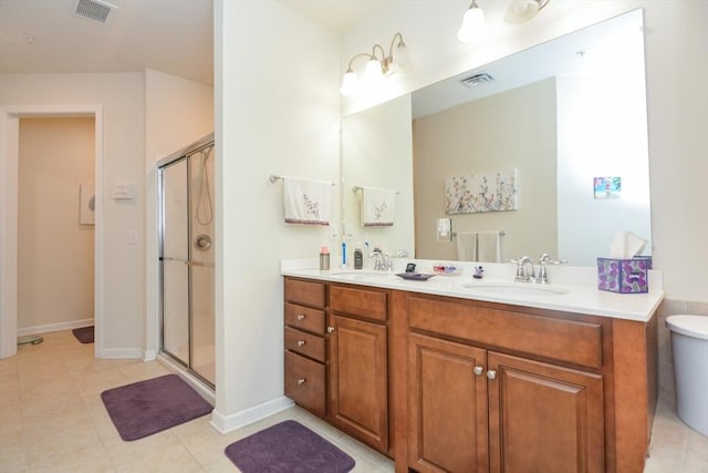 62 Abigail Way Unit 2003, Reading, MA 01867 - bathroom with a stall shower, double vanity, and tile patterned floors
