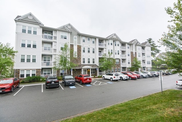 62 Abigail Way Unit 2003, Reading, MA 01867 - view of building exterior with uncovered parking