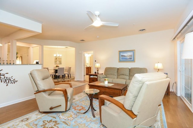 62 Abigail Way Unit 2003, Reading, MA 01867 - living room with wood finished floors, a ceiling fan, and a chandelier