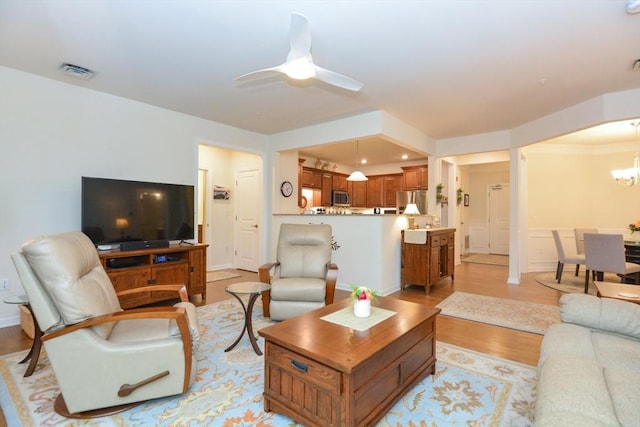 62 Abigail Way Unit 2003, Reading, MA 01867 - living area with light wood-style floors, a chandelier, and ceiling fan